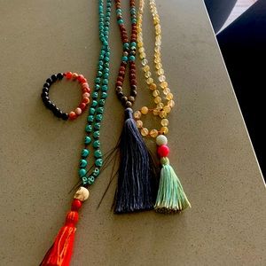 Three mala necklaces and one bracelet.